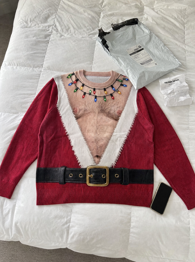 Customer holding Azyro Christmas Sweater