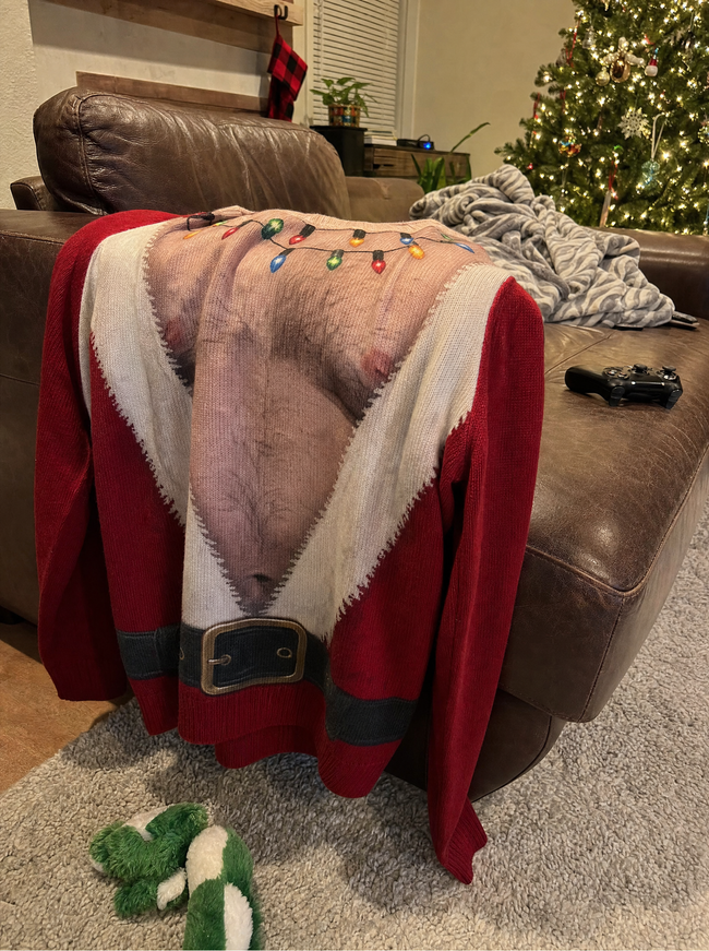Azyro Christmas Sweater near a Christmas tree